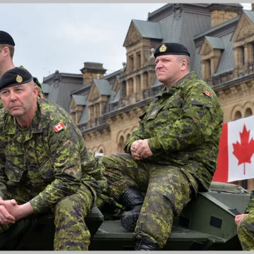 canadian armed forces sitting in armored vehicle