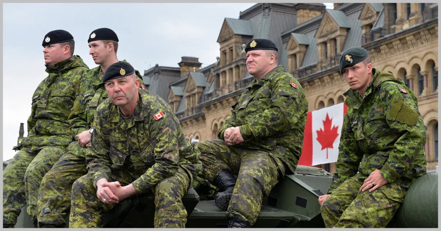 canadian armed forces sitting in armored vehicle